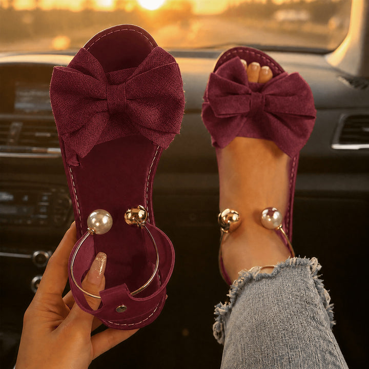 Vennla | Bow Flat Sandals with Pearl Ankle Cuff in product view 16